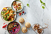 Healthy breakfast bowls with muesli, fruit and yoghurt