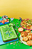 Football pitch party cake with snacks