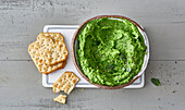 Pea and avocado spread with crackers