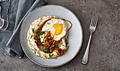 Cauliflower and bean puree with fried egg and fried onions