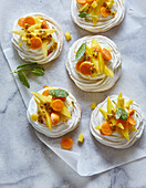 Mini pavlovas with mango and physalis