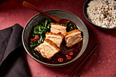 Pork belly in soy sauce with spinach and rice