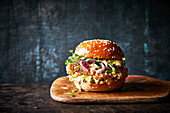 Chicken burger with caramelised onions and rocket salad