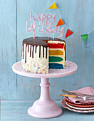 Rainbow cake with chocolate icing