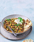 Keema beef curry with peas and naan bread