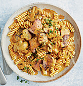 Boeuf Stroganoff with creamy curry sauce and fusilli