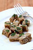 Polenta di Roveja (polenta with wild pea flour) served with sage butter