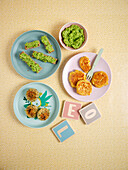Finger food for children: vegetable fritters, avocado bread and pancakes