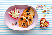 Blueberry quark pancakes with apple sticks and nuts