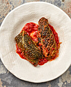 Savoy cabbage parcels in tomato sauce