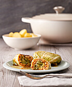Cabbage rolls with rice filling and steamed potatoes