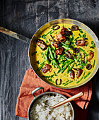 Date and bacon curry with green beans and rice