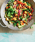 Asian vegetable stir-fry with tofu and sesame seeds