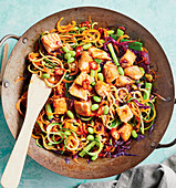 Vegetable wok with chicken, edamame and red chillies