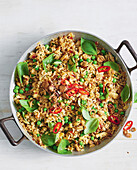 Fried rice with peas, chilli peppers and Thai basil