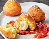 Crispy arancini with tomato sauce