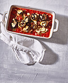 Baked aubergine rolls in tomato sauce