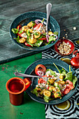 South African banana salad with spinach and tomatoes
