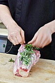 Wrap veal shank with rosemary