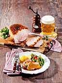 Bavarian crusted roast with bacon beans and boiled potatoes