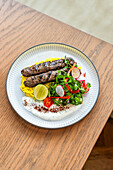 Beef kebab with rice and salad