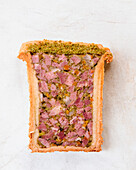 Pork pâté with pistachios and herb crust