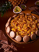 Tarte mogador with pineapple, passion fruit and macarons