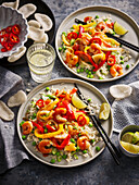 Prawn and vegetable pan with peppers and lime on rice