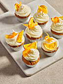 Carrot and orange cupcakes with cream cheese topping