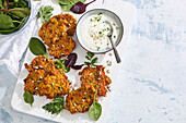 Chicken and carrot pancakes with herb yoghurt dip