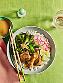 Rice bowl with crispy tofu satay and vegetables