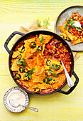 Tex-Mex taco pot au gratin with minced meat and jalapeno