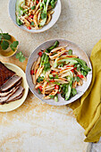 Scissor-cut noodles with pork belly, pak choy and chili