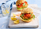 Fish burger with marinated carrots, peppers and coriander