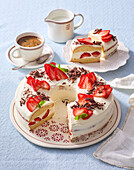 Quark and strawberry bundt cake with chocolate shavings