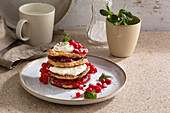 Buckwheat pancakes with redcurrants and cream