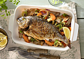 Sea bream with vegetables and herbs from the oven