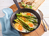 Asparagus with fried egg and cheddar cheese