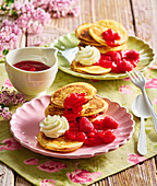 Ricotta pancakes with raspberry sauce and whipped cream