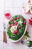 Wild asparagus with burrata and raspberries