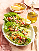 Romaine lettuce hearts filled with vegetable bulgur salad