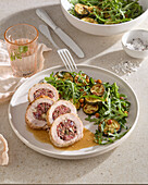 Turkey roulade with salsiccia filling and rocket and zucchini salad