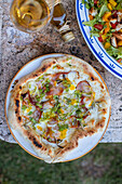 Tarte flambée with bacon and spring onions