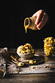 Caramel ice cream with salted popcorn and caramel sauce