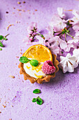 Mini lemon tartlets with raspberry and mint