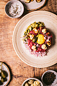 Beefsteak tartare with egg yolk, capers and mushrooms