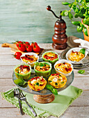 Small, savoury bacon and tomato quiches