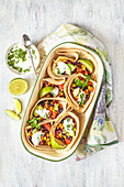 Baked tortillas with Mexican vegetables and coriander yogurt