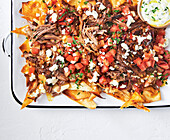 Lamb nachos with tomatoes and feta