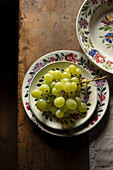 Green grapes on antique plates